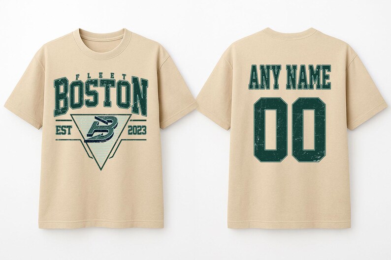May include: A beige t-shirt with a distressed green graphic on the front that says "BOSTON" above a triangle with a "B" logo and "EST 2023". The back of the shirt has "ANY NAME" above the number "00".