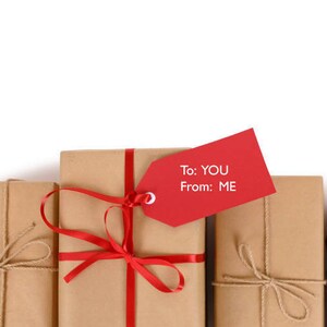 May include: Three brown gift boxes wrapped with twine and red ribbon. The middle box has a red gift tag that says "To: YOU From: ME".