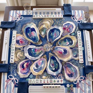 May include: A square mahjong mat featuring a watercolor-style illustration of blue and purple oysters arranged in a circular pattern. The mat includes white tile racks, mahjong tiles with Chinese characters, and blue and white striped borders.