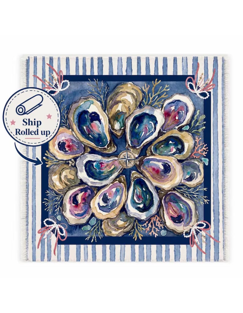 May include: A square textile featuring a watercolor illustration of oysters arranged in a circular pattern around a central compass rose. The design includes coral accents, pearl-like strings, and a blue and white striped border with frayed edges.
