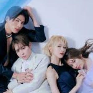 May include: A white ceramic mug with a black handle and the text "But First, Coffee" in a handwritten style. The mug is on a white surface.