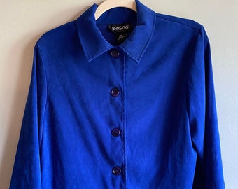 May include: A royal blue button-up jacket with a collar and long sleeves. The jacket has a label that reads "Briggs" on the inside.