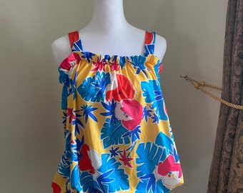 May include: A yellow, blue, red, and white floral print top with thin straps and a drawstring at the bottom.