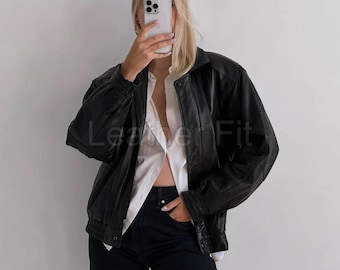 Oversized zwart leren bomberjack: vintage jas met rits