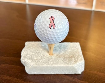 Exhibición de pelota de golf de cuarzo para concientización sobre el cáncer de mama