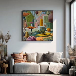May include: A colorful abstract painting in a black frame hangs above a sofa. The artwork features a surreal landscape with orange, green, and purple elements. The sofa has neutral-toned cushions and pillows, creating a cozy living room setting.