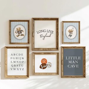 May include: A collection of framed art prints featuring sports themes. The prints include a basketball, football, and baseball, along with text that reads "Long Live Boyhood" and "Little Man Cave". The art is in a vintage style.