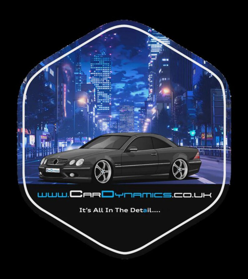 May include: A stylized image of a dark gray coupe car with silver rims, set against a nighttime cityscape with bright lights. The image is within a white-bordered, hexagonal shape. The text "www.CarDynamics.co.uk" and "It's All In The Detail...." are at the bottom.