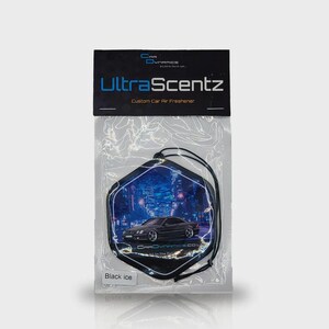 May include: A custom car air freshener in a clear plastic package. The air freshener is black and shaped like a hexagon with a car graphic and the words "UltraScentz" and "Black Ice" printed on it.