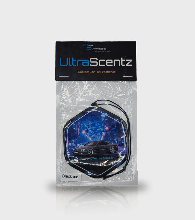 May include: A custom car air freshener in a clear plastic package. The air freshener is black and shaped like a hexagon with a car graphic and the words "UltraScentz" and "Black Ice" printed on it.