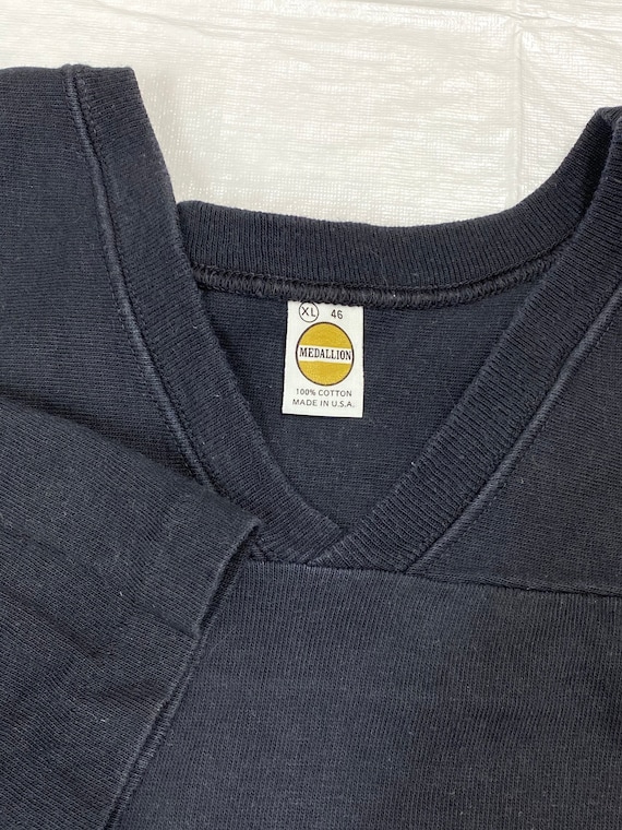 Pick one 1970s black cotton football jersey tshirt … Gem