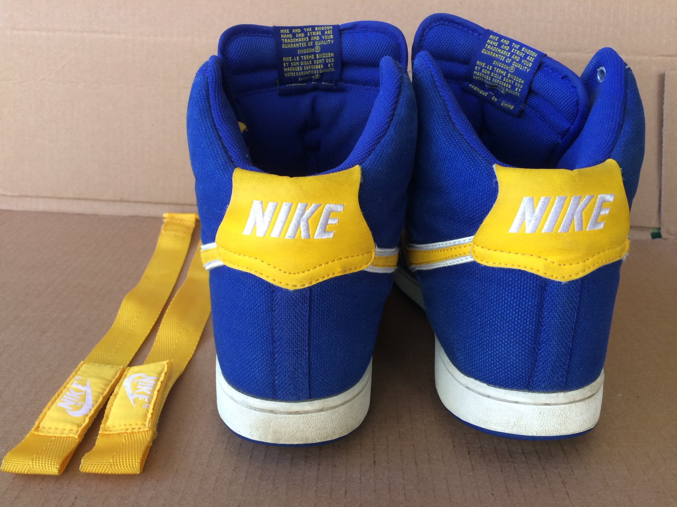 blue and yellow nike high tops