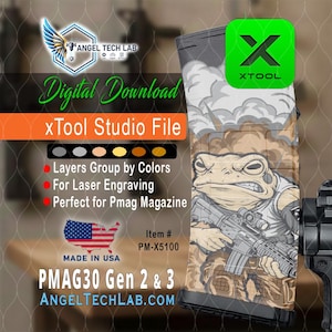 May include: Digital download file for laser engraving. The design features a cartoon frog with a weapon, set against a background of clouds. The text includes "xTool Studio File", "PMAG30 Gen 2 & 3", and "Made in USA".