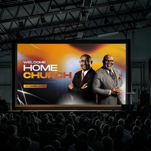 May include: A large screen displays the words "WELCOME HOME CHURCH" with two men in suits. The background is a blend of orange, yellow, and black. A crowd of people is seated in front of the screen.