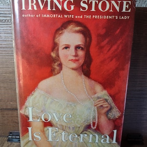 May include: A set of three ceramic mugs with a speckled, matte finish. The mugs are in shades of cream, light gray, and dark gray. Each mug has a simple, minimalist design and a rounded handle.