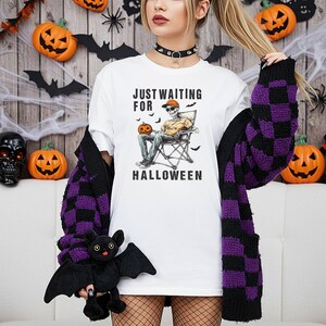 Just Waiting for Halloween Shirt or Sweatshirt – Funny Skeleton Sitting Graphic – Spooky Season Tee for Horror Fans and Halloween Lovers