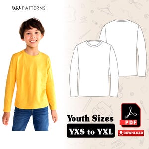 Könnte beinhalten: Ein Kind trägt ein gelbes Langarmshirt und blaue Jeans. Das Bild zeigt auch eine Strichzeichnung eines Langarmshirts und den Text "Youth Sizes YXS to YXL".