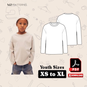 Könnte beinhalten: Ein Kind trägt ein hellbeige Langarmshirt und blaue Jeans. Das Bild zeigt auch eine Strichzeichnung des Shirts und ein PDF-Download-Symbol mit dem Text "Youth Sizes XS to XL".