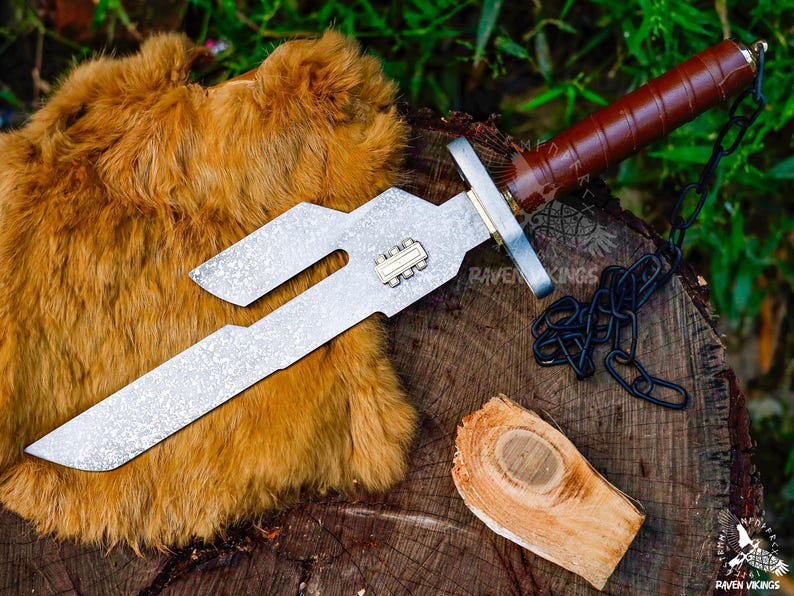 May include: A silver and brown dagger with a textured blade and a leather-wrapped handle. The dagger has a unique, angular design and is accompanied by a black chain. A piece of wood and a fur-like material are also present.