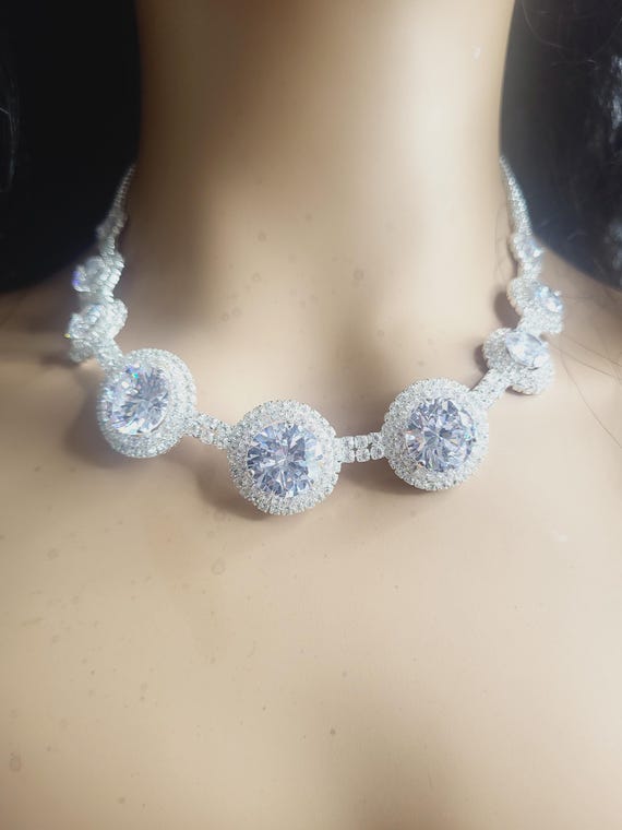 Parure collana e orecchini con elemento in argento con zirconi