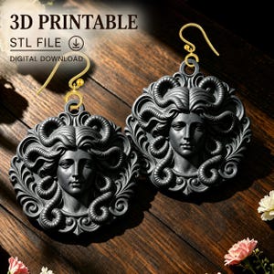 May include: A pair of dark gray Medusa-themed earrings featuring intricate snake hair details and gold-toned metal hooks. The image includes the text 3D PRINTABLE, STL FILE, and DIGITAL DOWNLOAD, indicating this is a file for 3D printing.