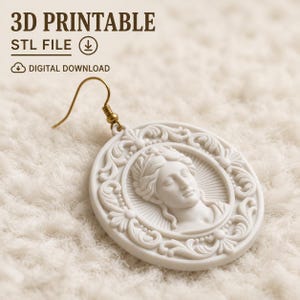 May include: A white circular earring featuring a relief portrait of a classical figure surrounded by ornate scrollwork. The piece includes a gold-toned metal hook. The image displays the text 3D PRINTABLE, STL FILE, and DIGITAL DOWNLOAD.