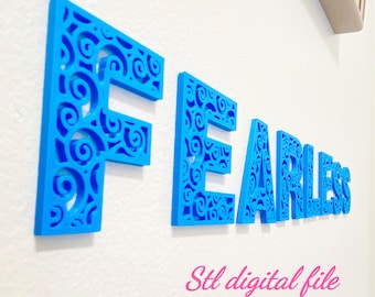 May include: Bright blue wall-mounted letters spelling the word FEARLESS. Each letter features an intricate, cut-out swirl pattern throughout its structure. The text Stl digital file is printed in pink script at the bottom of the image.