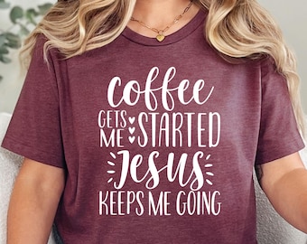 May include: A maroon t-shirt with the text "coffee gets me started Jesus keeps me going" in white script. The shirt is paired with blue jeans. The overall theme is faith and coffee.