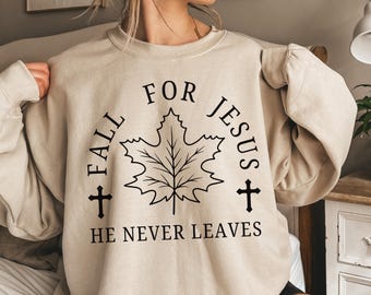 Fall for Jesus He Never Leaves Sweatshirt – Christian Autumn Pullover, Faith-Based Thanksgiving Shirt, Religious Fall Host Gift