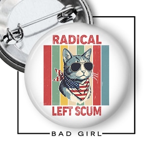 May include: A round pin-back button featuring a graphic of a cat wearing sunglasses and a bandana with an American flag pattern. The background consists of vertical stripes in muted colors. The text RADICAL LEFT SCUM is printed in red.