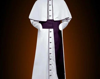 May include: A white cassock with a purple sash and trim. The cassock has a long, flowing skirt and a high collar. It is a traditional garment worn by clergy.
