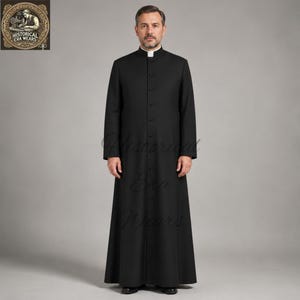 May include: A black cassock featuring a high mandarin collar with a white clerical tab insert, long sleeves, and a full-length front button placket. The garment is floor-length with a structured fit, clean lines, and a solid black fabric finish.
