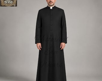 May include: A black cassock featuring a high mandarin collar with a white clerical tab insert, long sleeves, and a full-length front button placket. The garment is floor-length with a structured fit, clean lines, and a solid black fabric finish.