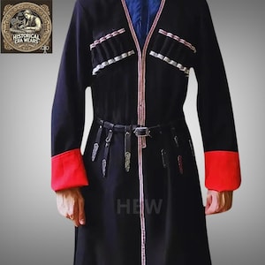 May include: A long black coat with red trim on the cuffs and a red and white trim down the front. The coat has a leather belt with a silver buckle and several decorative silver accents. The text "HEW" is visible on the front of the coat.