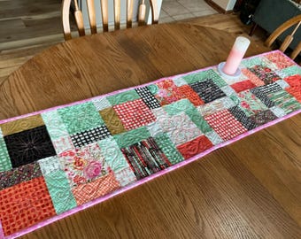 Floral Surprise 13x52 quilted table runner in pink, orange, mint, bronze, cream and black