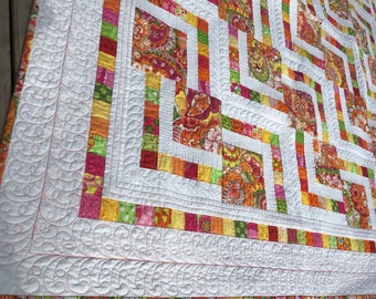 Stairways 68x79 quilt in bright, tropical colors on white