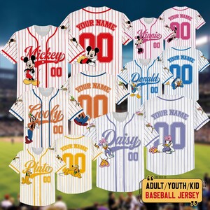 May include: A collection of baseball jerseys with Disney characters including Mickey, Minnie, Donald, and Goofy. Each jersey features a character graphic, the number "00", and space for a custom name. Available in adult, youth, and kid sizes.