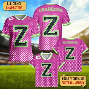 May include: Pink football jerseys with white polka dots, green and white trim, and a large black and green "Z" on the front and back. The text "SEABROOK" is on the back. The text "ALL DISNEY CHARACTERS" and "ADULT/YOUTH/KID FOOTBALL JERSEY" are also visible.