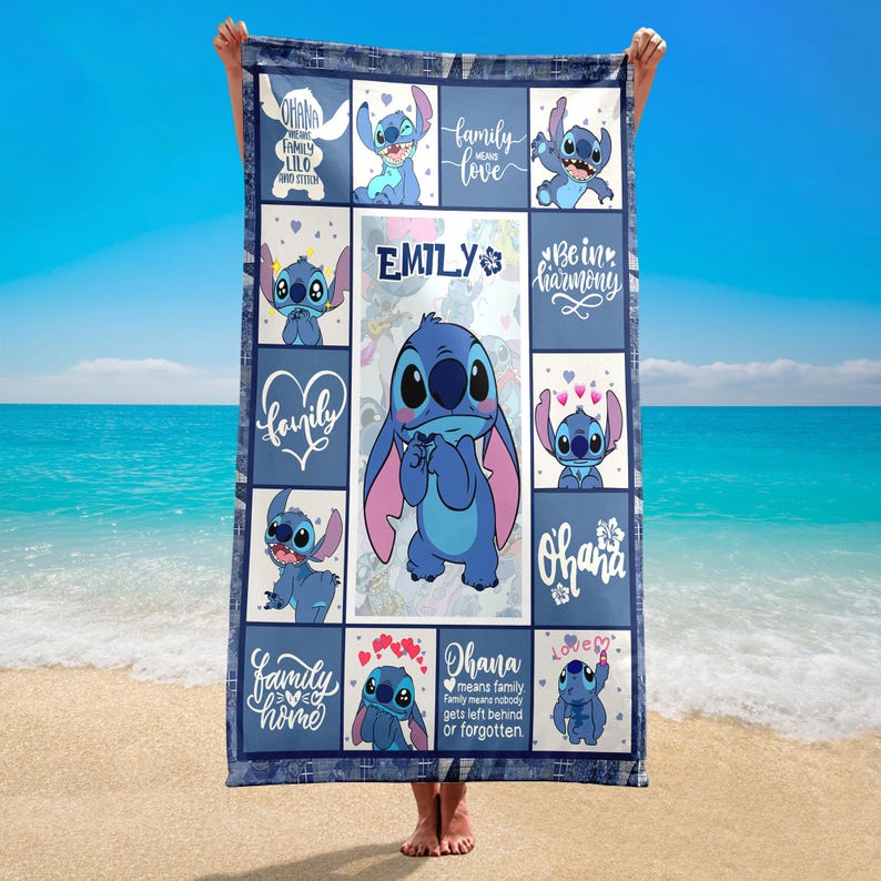 May include: A blue and white blanket featuring the character Stitch from Lilo & Stitch. The blanket has a patchwork design with various images of Stitch and phrases like "Ohana" and "Family". The name "Emily" is also featured.