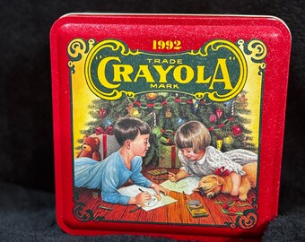 Caja de almacenamiento coleccionable navideña Crayola Holiday Tin de 1992 con diseño de deseos coloridos.