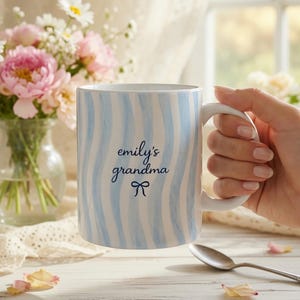 May include: A set of three ceramic mugs with a speckled, matte finish in cream, light grey, and dark grey. Each mug has a simple, minimalist design, suitable for coffee or tea.