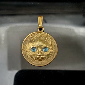 14K gold cat pendant with cabachon blue topaz eyes