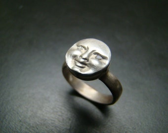 Sterling Silver moonface / sunface ring with diamond eyes.