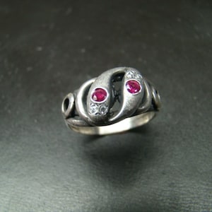 Beautiful Sterling Silver snake ring with genuine diamonds and fine rubies.