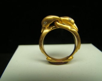 Romantic 14k Gold double swan ring with diamonds