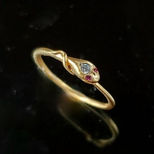 Very sweet 14K gold snake ring with diamond and ruby eyes