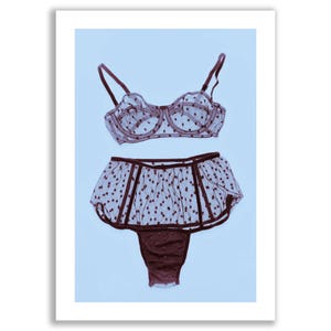 May include: A set of black lingerie with a polka dot pattern. The bra has a delicate lace design and the panties have a high-waisted style.