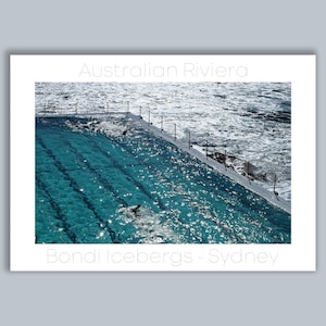 Bondi Icebergs, a wall art travel poster of two lap swimmers in morning sun at Sydney Australia's famous ocean pool
