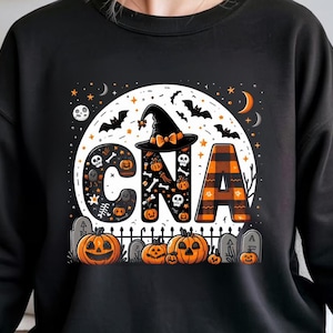 May include: Black sweatshirt with a Halloween-themed design. The design features the letters "CNA" with a witch hat, pumpkins, bats, and a full moon. The letter "A" has an orange and black plaid pattern.
