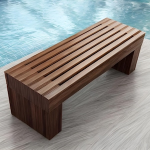 May include: A wooden bench with a slatted seat and a rectangular base. The bench is made of dark brown wood and is positioned near a pool. The bench's design is modern and minimalist, suitable for outdoor use.